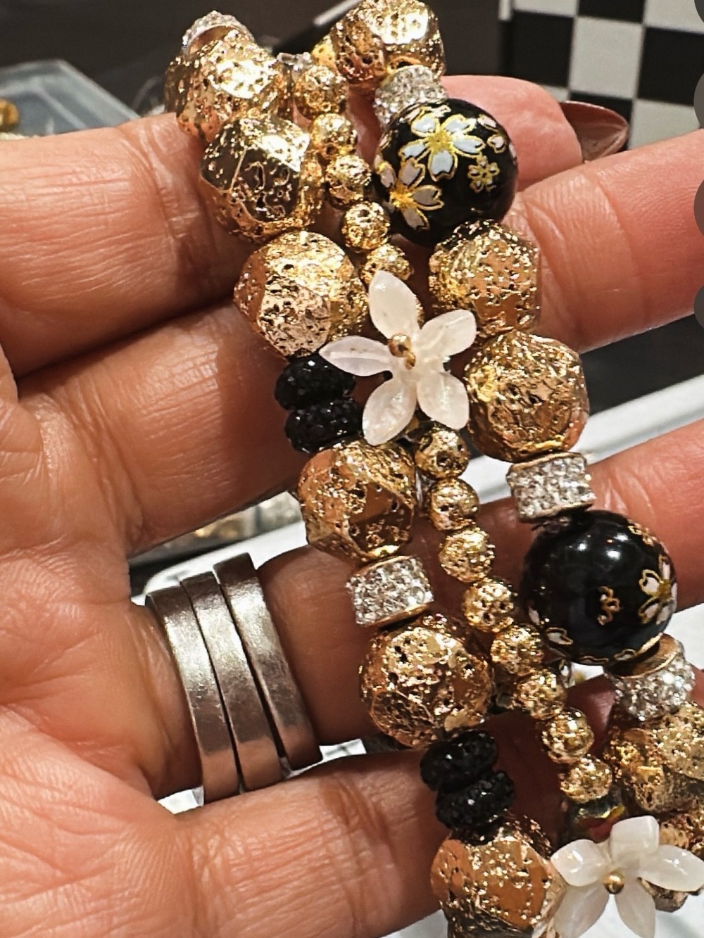 Gold and Black Floral Beaded Bracelet with White Flower Accents